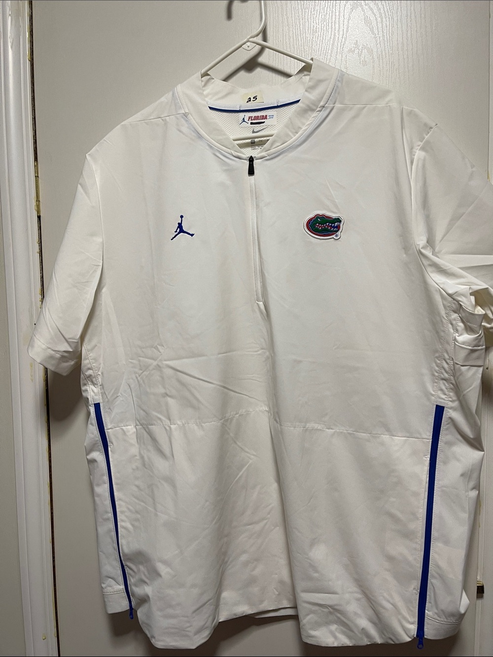 #25 Jordan White Short-Sleeve Zip Warm-Up Shirt with Blue Accents
